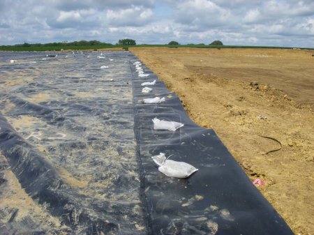 Photo for Landfill expansion project with clay cover and HDPE synthetic liner. High quality photo - Royalty Free Image