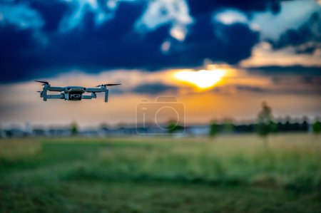 Drone hovering above the skyline as dusk approaches. . High quality photo