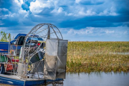 airboat in the everglades of Florida with grass and wetland swamp in the background. High quality photo