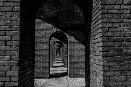 Endless brick passage with repeating archways in Fort Jefferson on Dry Tortugas National Park. High quality photo