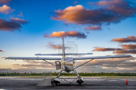 Small seaplane on private airport tarmac . High quality photo