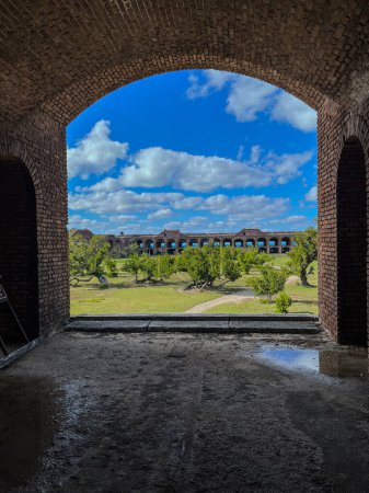 Photo for View through an open archway in Fort Jefferson on Dry Tortugas National Park with a the open courtyard a parade ground in the distance. High quality photo - Royalty Free Image