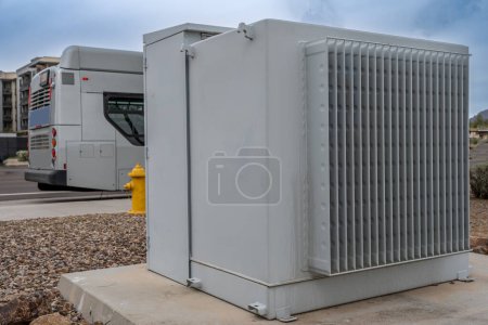 Selective focus on an electric transformer outside a commercial building. . High quality photo