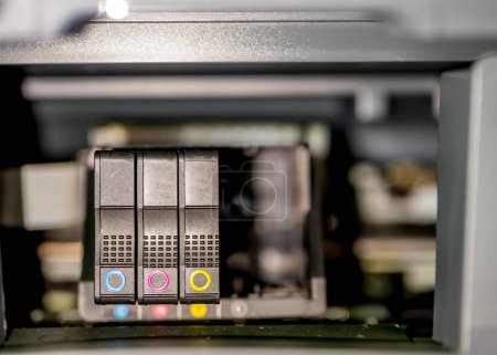 Generic printer ink cartridge being replaced. High quality photo