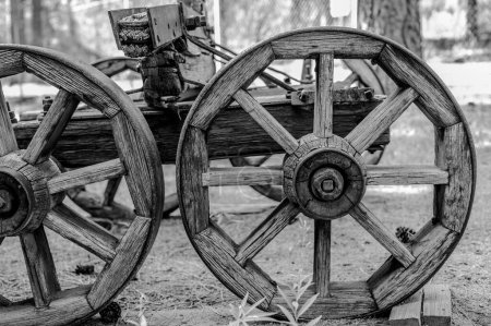 Chiloquin, Oregon - 8.8.2023 - Wagon with wooden wheels on display at the Collier Memorial State Park Logging Museum. High quality photo