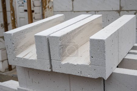 U Blocks of aerated concrete close-up, blocks for pouring concrete. Laying aerated concrete blocks. Construction of aerated concrete blocks, bricks. High quality photo