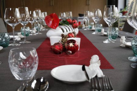 Photo for Festive christmas decorations on a dinner table - Royalty Free Image