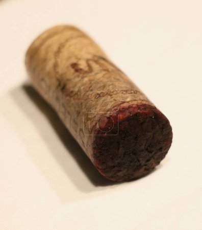 Photo for A natural wine cork with little cork bleed of red wine - Royalty Free Image