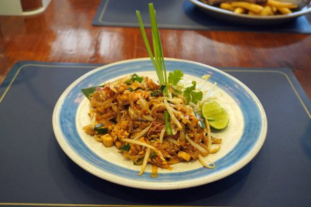 Photo for Pad thai, phat thai, or phad thai is a stir-fried rice noodle dish commonly served as a street food in Thailand. Pad Thai, Selective focus - Royalty Free Image