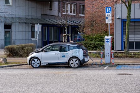 Photo for Hamburg, Germany - 06 01 2023: a bmw i3 electric car from drivenow is being charged at a charging station in hamburg - Royalty Free Image