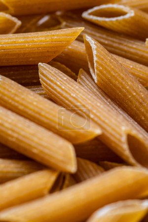Close up of a pile of uncooked whole wheat pasta