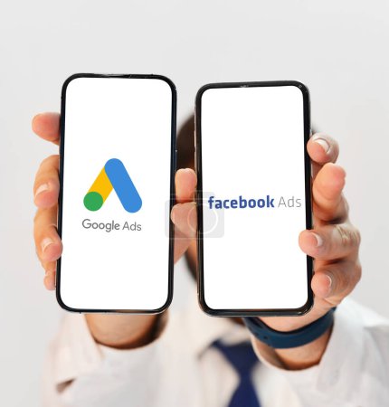Photo for Google Ads Vs Facebbook Ads Comparison in terms of performance, person showing on mobile screen editorial. - Royalty Free Image