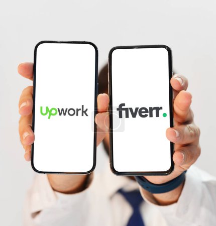 Photo for Upwork Vs Fiverr comparison for better freelancing opportunites for newbies and professionals, editorial background in tech - Royalty Free Image