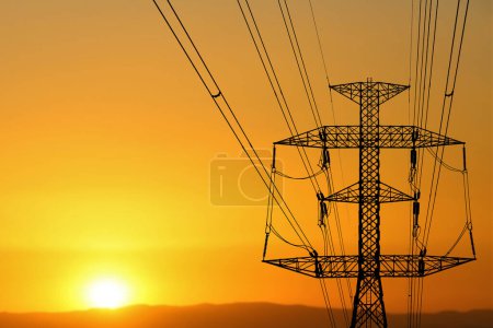 Photo for High voltage poles with silhouette Complex steel structure with a beautiful view - Royalty Free Image
