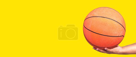 Photo for Hand holding basketball ball. basketball in hand with clipping path - Royalty Free Image