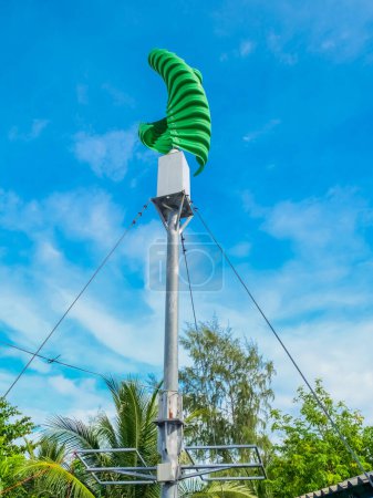 Photo for Green vertical type wind turbine. Alternative energy concept. Clean energy. - Royalty Free Image