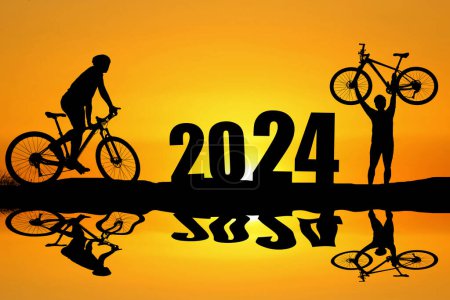 Photo for Bicyclists welcome 2024, happy new year and transition concept. - Royalty Free Image