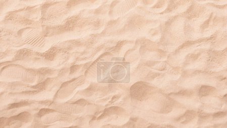 Téléchargez les photos : Vue du dessus du sable sur la plage, décor naturel - en image libre de droit