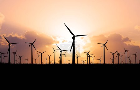 Photo for Wind turbines on the orange sky background, eco energy concept - Royalty Free Image