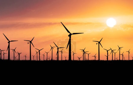 Photo for Wind turbines on the orange sky background, eco energy concept - Royalty Free Image
