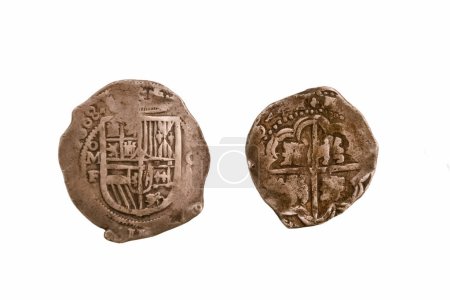 former silver spanish coin isolated on white background former means of payment