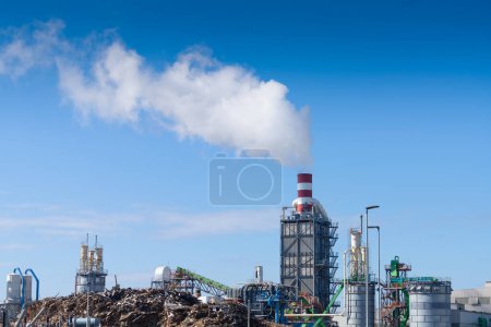 Photo for Smoke emissions from the chimney of an industrial plant - Royalty Free Image