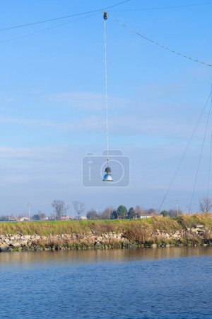 the lamp above the fishing nets immersed to catch fish in the Comacchio valley