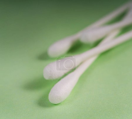 ear cleaning sticks on a colored background