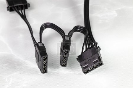 Photo for Molex connector, 4-pin power connector from modern PSU for all PATA equipment, peripherals isolated on reflection surface. - Royalty Free Image