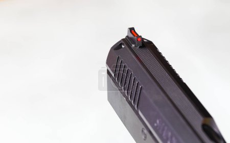 Fiber optic front gun sight on a semi automatic handgun.