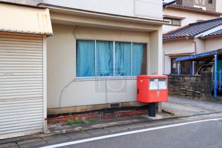 Red Japanese postbox on way side at nishi ward, Fukuoka.