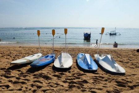 Photo for Sanur, Bali, Indonesia - February 7, 2021: canoe boats that are not used or rented. Illustration of the impact of the corona virus for Bali tourism - Royalty Free Image