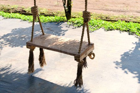 wooden swing on the terrace of the house