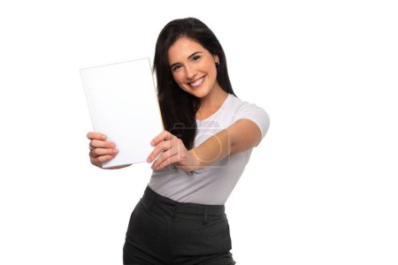 Photo for Cheerful and excited young brunette woman holding a blank white paper, copy space, for advertisement, advertising, message, add text - Royalty Free Image
