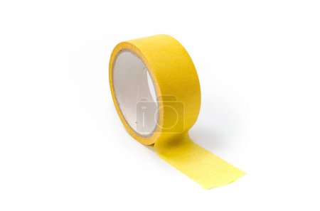 Photo for Roll of yellow masking tape on white background. - Royalty Free Image