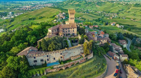 Ancient castle in the town of Cigognola, a view of the town from a height. Drone photo