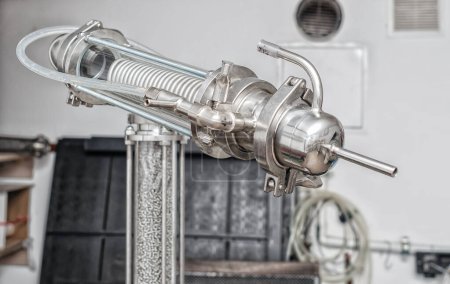 Shiny pipes of the unit for distilling alcohol at home