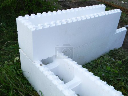 Photo for White ICF blocks  with two layers of insulation polystyrene. Insulated concrete forms construction without cement. - Royalty Free Image