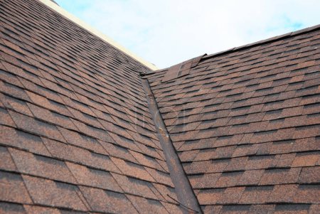 Photo for Asphalt shingles roofing construction, repair, installation, replace, renovation. Problem Areas for House Asphalt Shingles Corner Roofing Construction Waterproofing. - Royalty Free Image