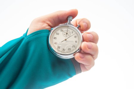 hand with a mechanical stopwatch on a white background. Time part precision. Measurement of the speed interval