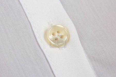 Photo for Sewn button to shirt close-up - Royalty Free Image