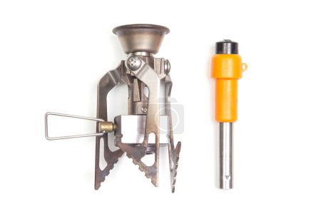 compact gas burner and lighter on a white background. tool for tourism and camping.