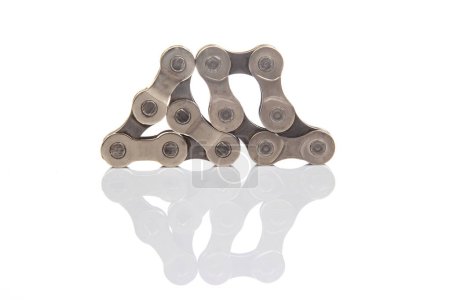 parts of bicycle chain links on white background
