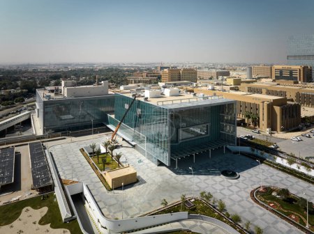 Photo for This captivating aerial photograph showcases the King Faisal Specialist Hospital Research Centre in Riyadh, Saudi Arabia. The image features the hospitals impressive modern tower, a gleaming symbol - Royalty Free Image