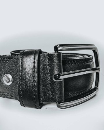 men's black leather belt, This high-resolution photo features a men's black leather belt, a staple accessory in any wardrobe. Crafted with precision, the belt showcases premium quality
