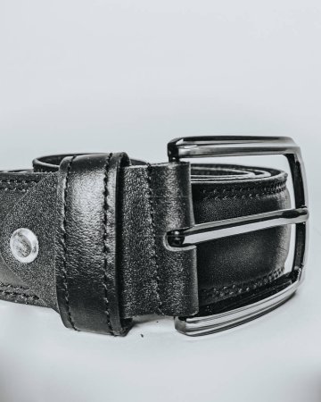 Men's Brown leather belt, This high-resolution photo features a men's black leather belt, a staple accessory in any wardrobe. Crafted with precision, the belt showcases premium quality