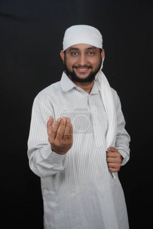 Photo for Religious Asian Muslim Boy Saying Salaam on Camera. Peaceful and Marvelous Warm Climate. Selective focus. - Royalty Free Image