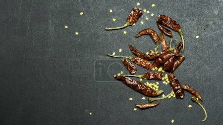 Photo for Dried chilli peppers on dark background - Royalty Free Image