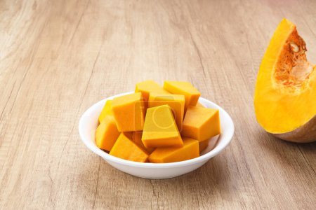 Photo for Pumpkin Slice or Labu Kuning on wooden table, food ingredient - Royalty Free Image
