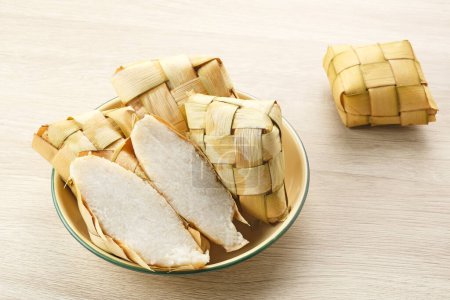 Photo for Ketupat or rice dumpling, a local delicacy popular during Eid al-Fitr. Indonesian traditional food - Royalty Free Image